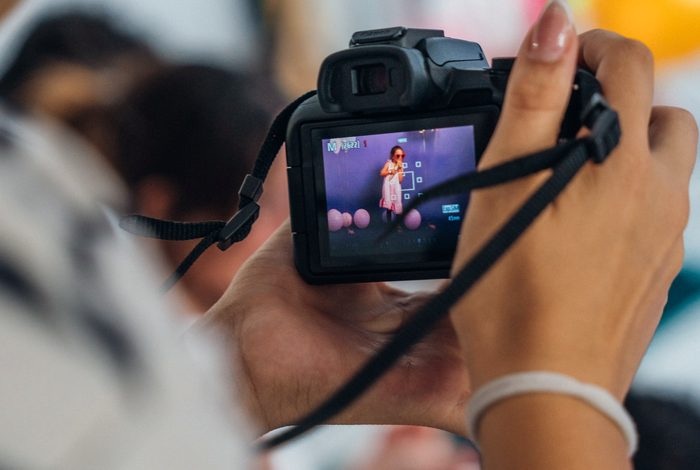 Young creative using a camera